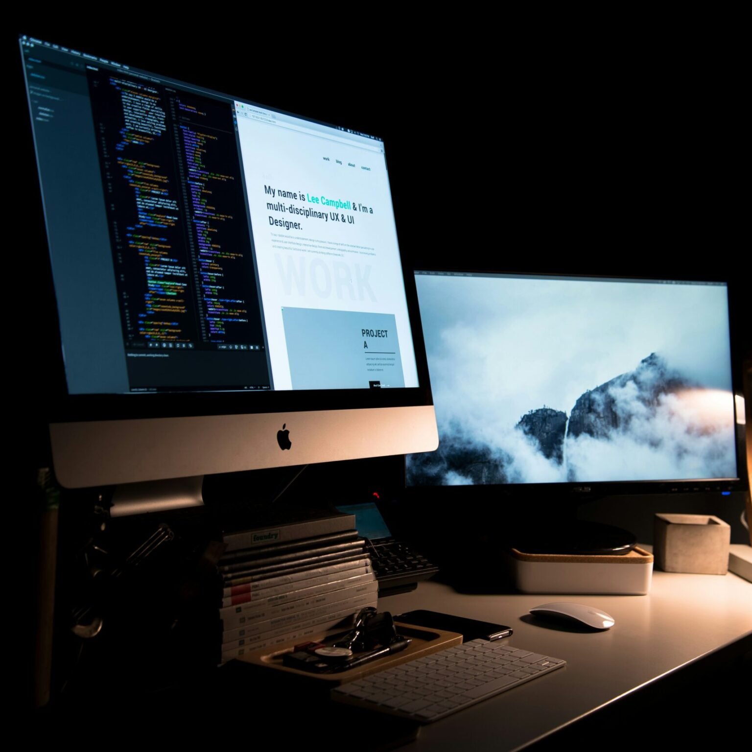 Web designer workspace with dual monitors displaying website UI and source code representing responsive web design in similarity to RevampX.